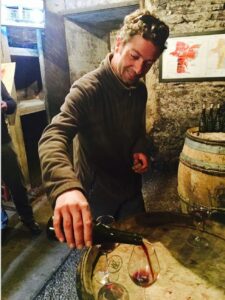 Harmand pouring wine