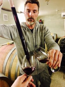 Lionnet pouring wine